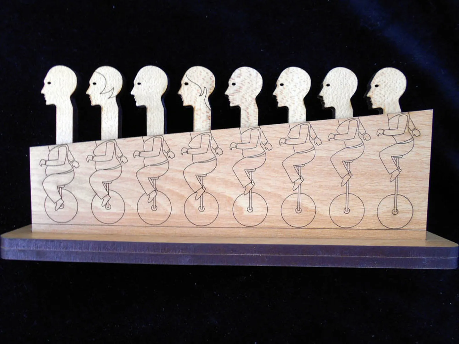 Holey Moley Premium Wood Brain Teaser Puzzle , 8 heads on Unicycles