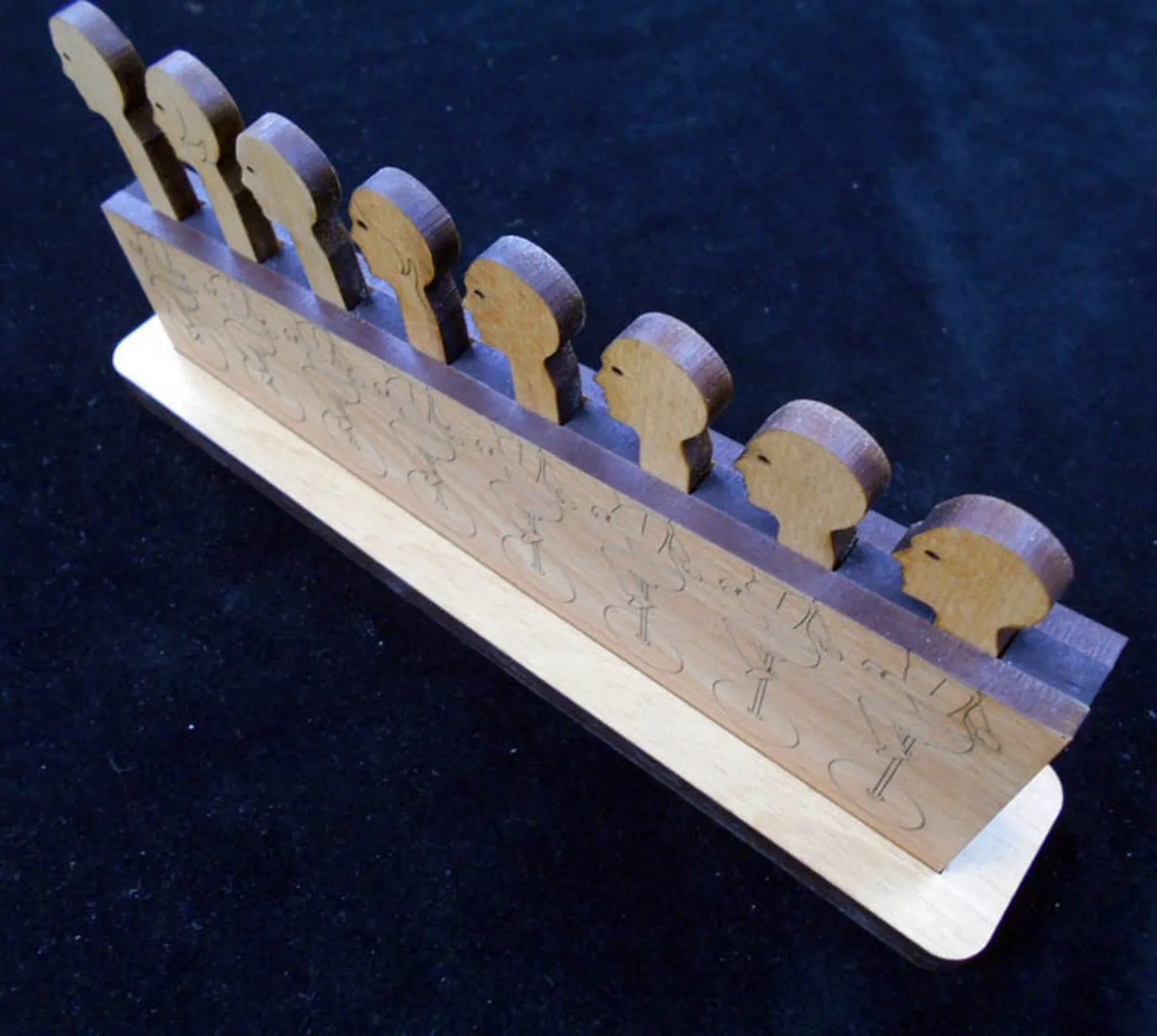 Holey Moley Premium Wood Brain Teaser Puzzle , 8 heads on Unicycles - Image 2